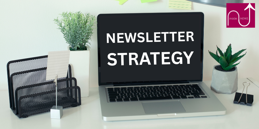 laptop on desk saying newsletter strategy
