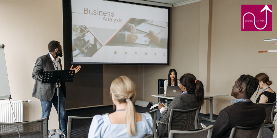 Group of people watching a presentation