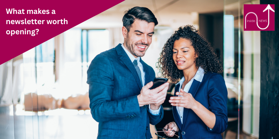 man and lady looking at mobile phone