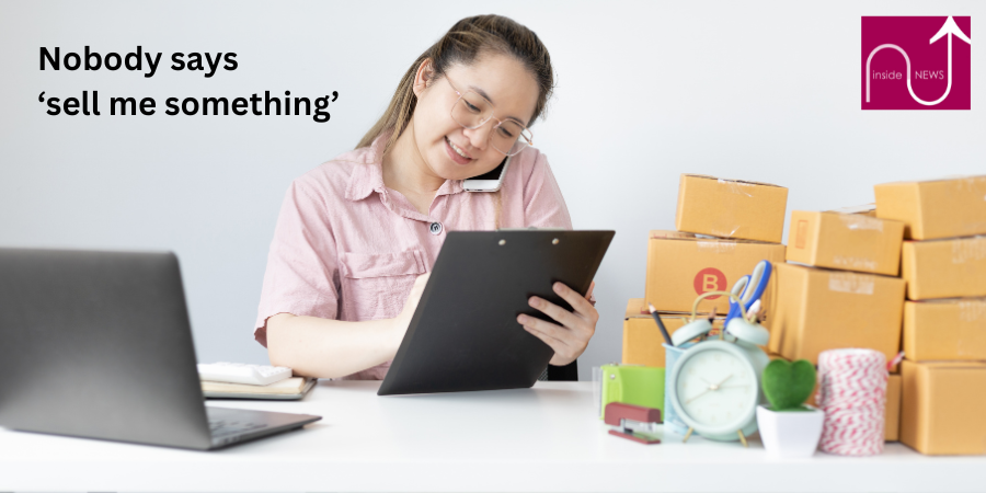 lady on phone looking at laptop